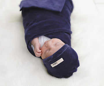 Child Wearing our Organic Velour Cute Cap in Navy.