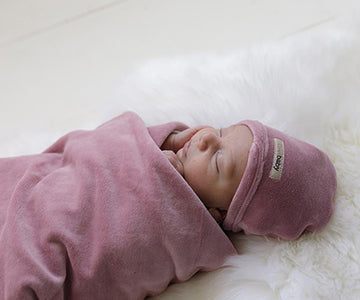 Child Wearing our Organic Velour Cute Cap in Mauve.